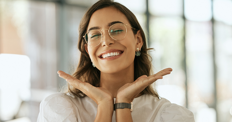 Woman in glasses showing her smile